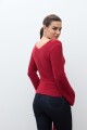 Sweater con lazo rojo