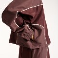 Campera Lifestyle New Balance de Dama Trackside WJ6279FYYLR BROWN