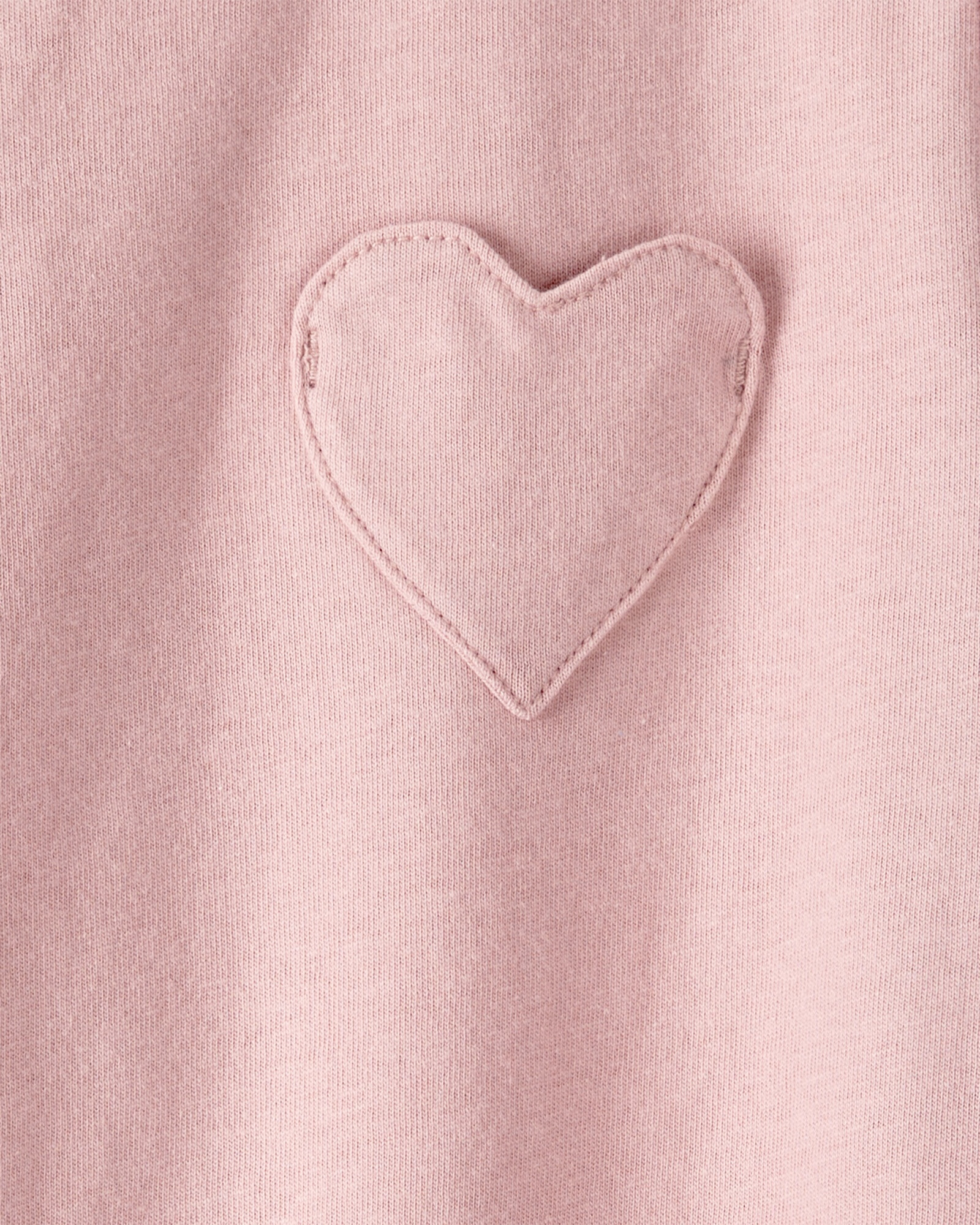Remera de algodón, manga corta, rosada, bolsillo corazón Sin color