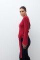 Sweater con lazo rojo
