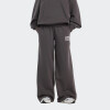 Pantalón New Balance Reimagined Fleece Gris
