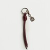 Llavero Charm Coin en cuero graneado Bordeaux