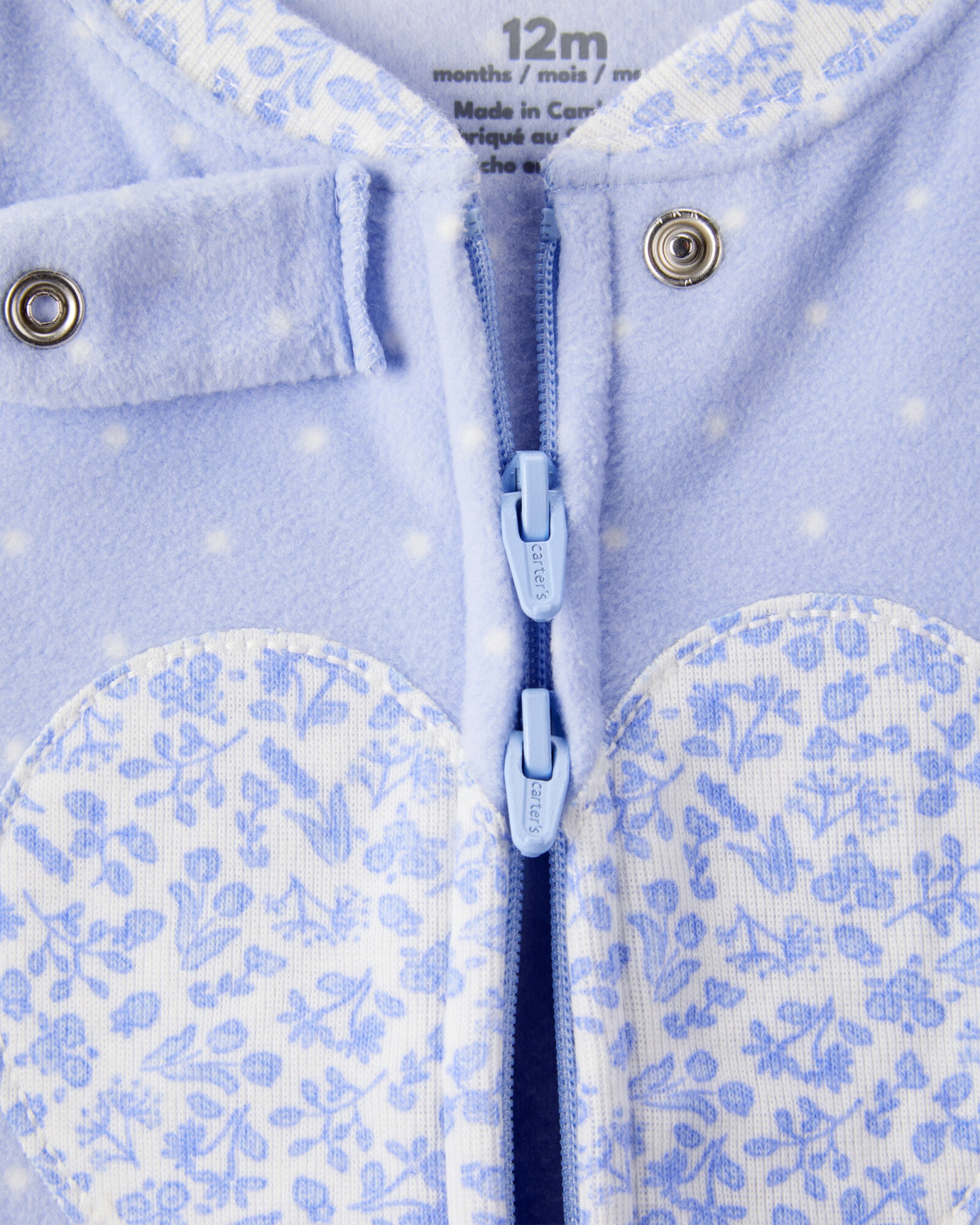 Pijama una pieza de micropolar, con pie, estampa corazón Sin color