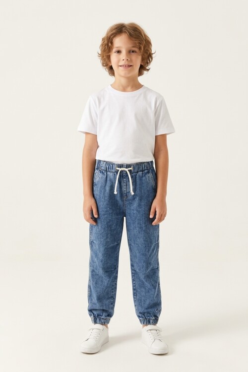 Jogger de jean con cortes JEAN MEDIO