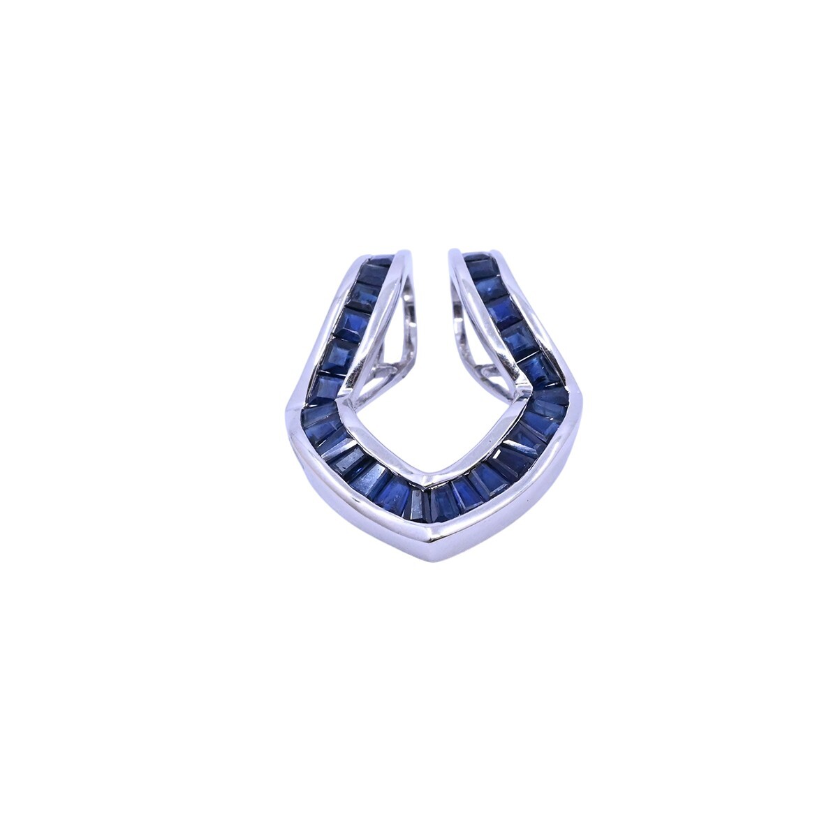 Dije oro 18k blanco con zafiros azules. 