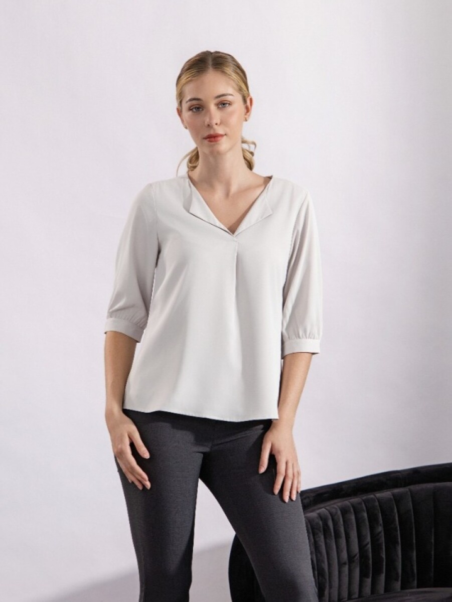 Blusa con Solapa. 
