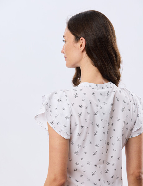 BLUSA CON VOLADOS Hojas Negra