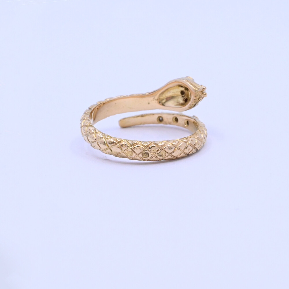Anillo oro 18k brillantes y rubíes serpiente con punzones. Anillo oro 18k brillantes y rubíes serpiente con punzones.