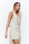 Falda corta con nudo beige