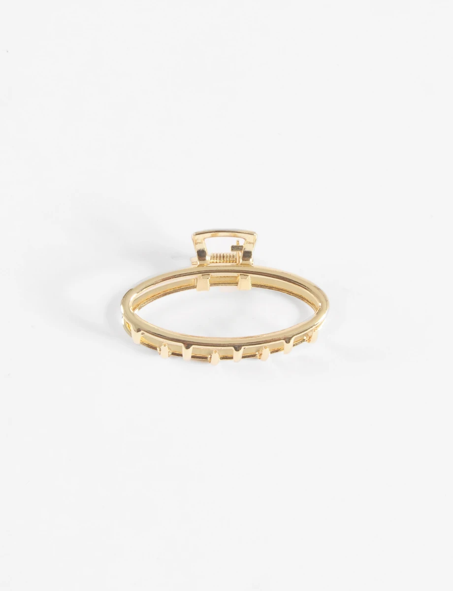Broche metálico ovalado - dorado 