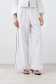 Pantalón de lino con vivo en contraste blanco