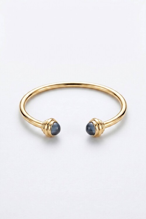 Pulsera rigida detalle dorado