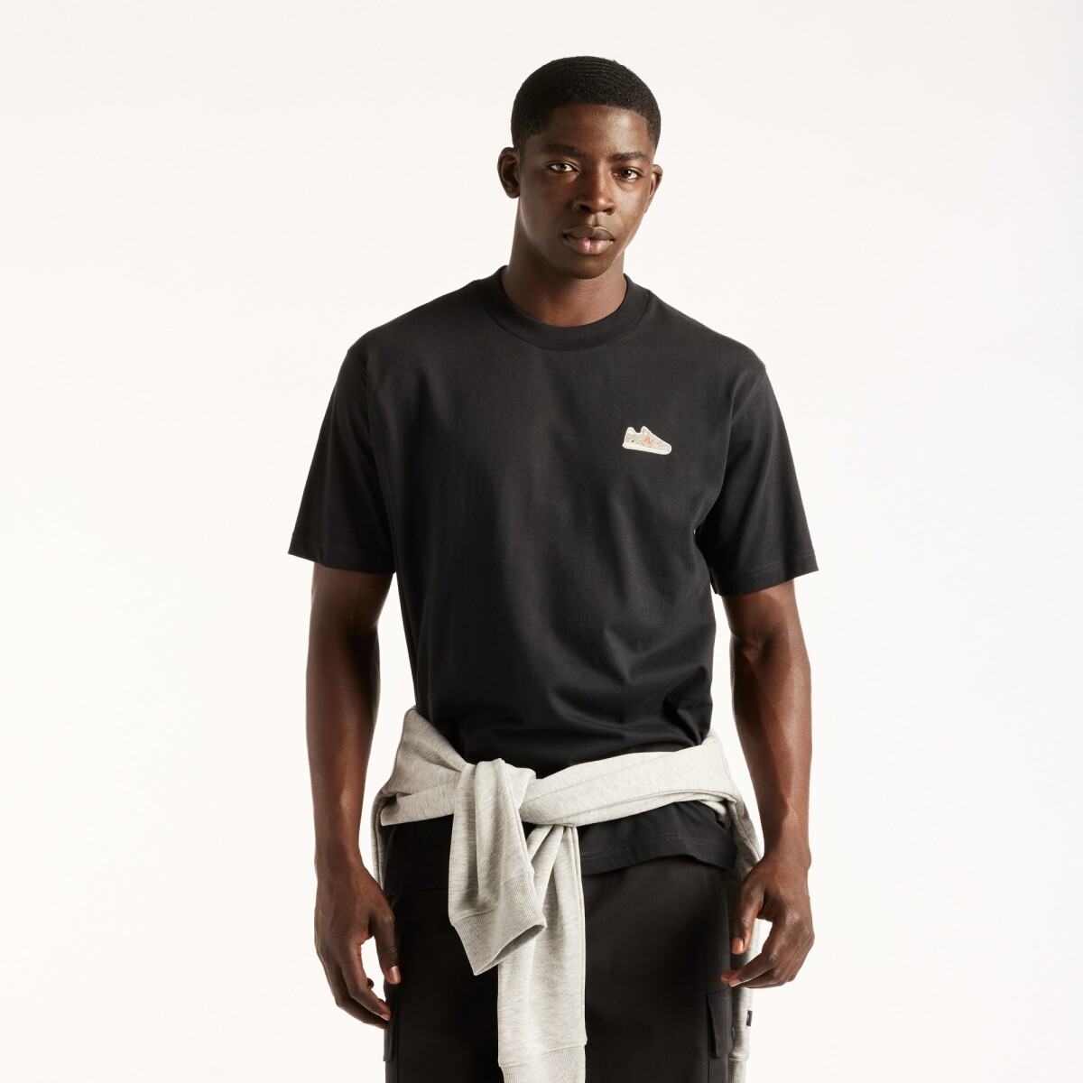 Remera New Balance de Hombre - Sticker Pack - MT62E2FFBK - BLACK 