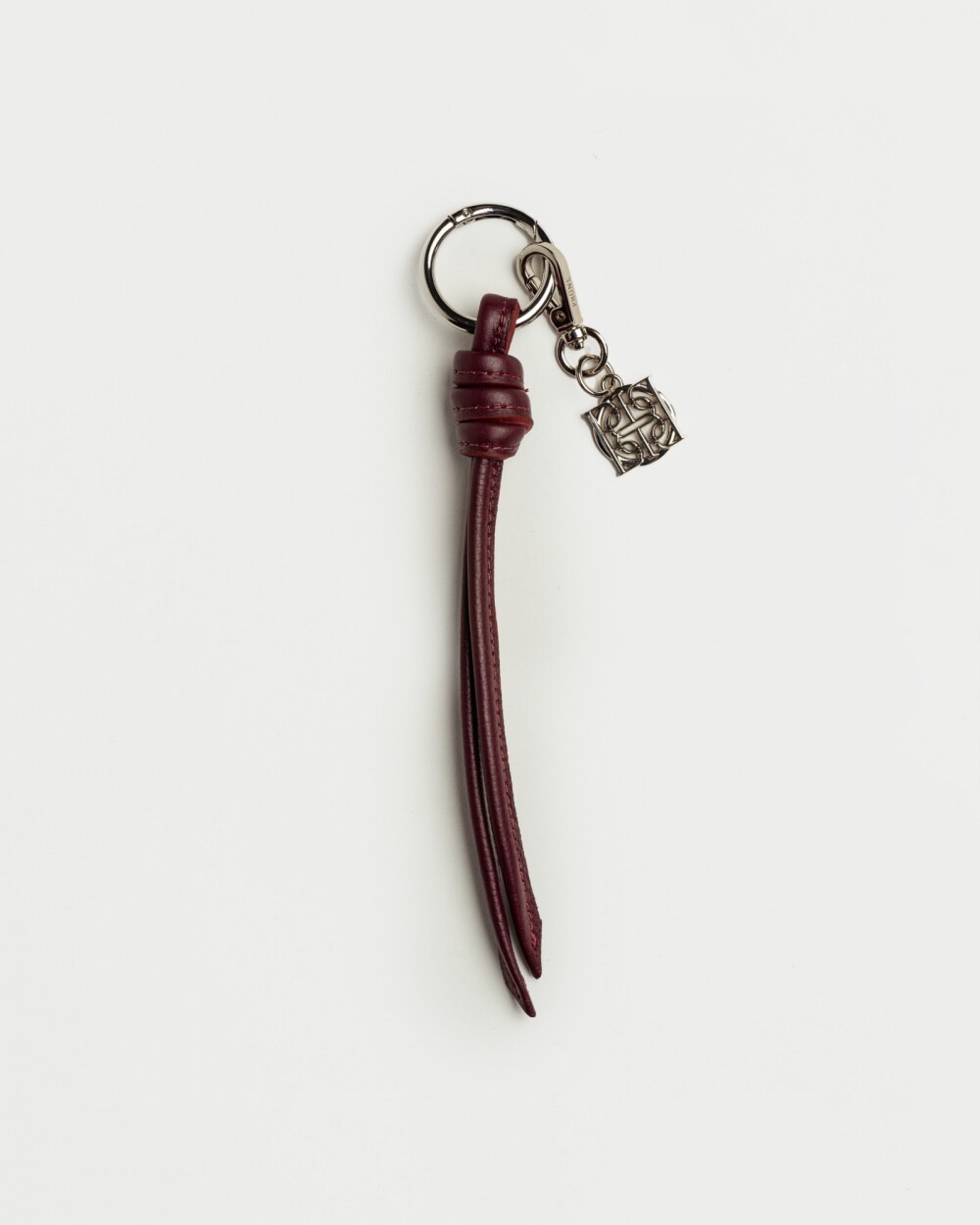 Llavero Charm Coin en cuero graneado Bordeaux