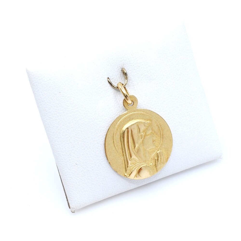 Medalla en oro 18k amarillo, con virgen. Diámetro 18mm Medalla en oro 18k amarillo, con virgen. Diámetro 18mm