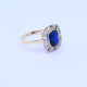 Anillo oro 18k antiguo con piedra de color y brillantes. Anillo oro 18k antiguo con piedra de color y brillantes.