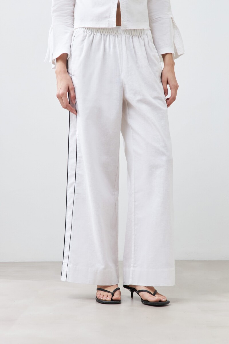 Pantalón de lino con vivo en contraste blanco