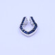 Dije oro 18k blanco con zafiros azules. Dije oro 18k blanco con zafiros azules.