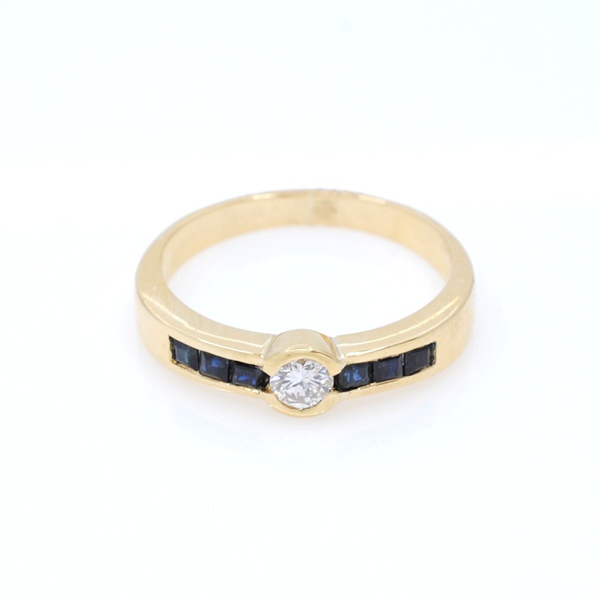 Anillo oro 18k y brillante y zafiros 