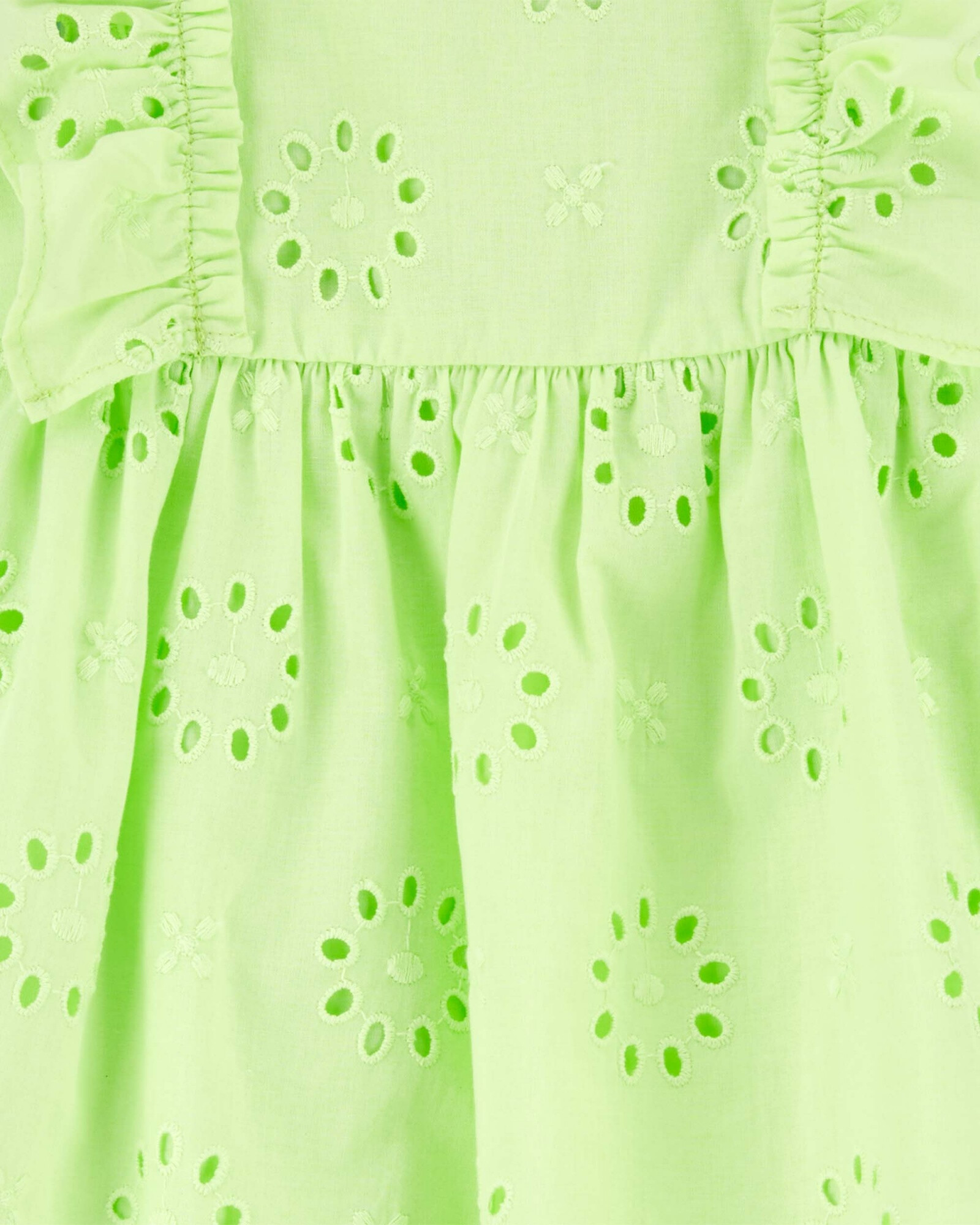 Vestido de algodón con volantes y ojales. Talles 0-24M Sin color