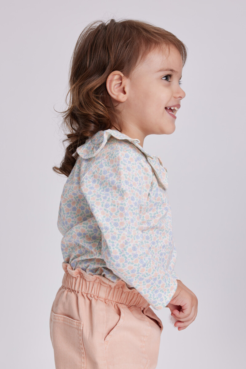 Remera manga larga cuello Flores Crema