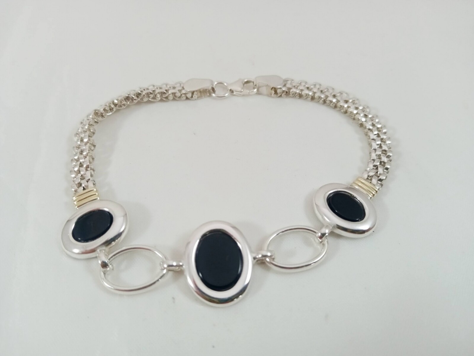 Pulsera de plata y oro con Onix 