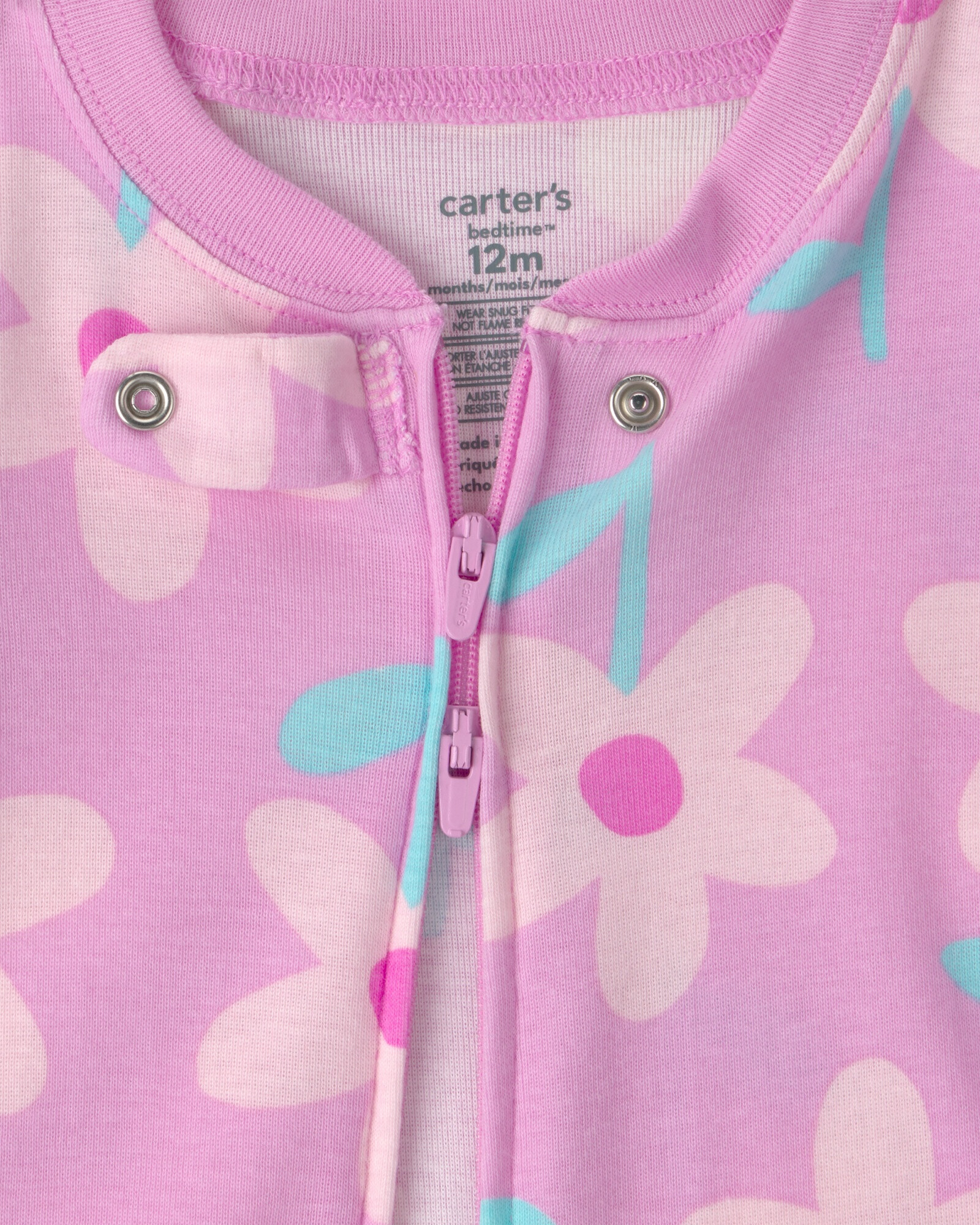 Pijama enterito de algodón, rosado, diseño floral. Talles 12-24M Sin color