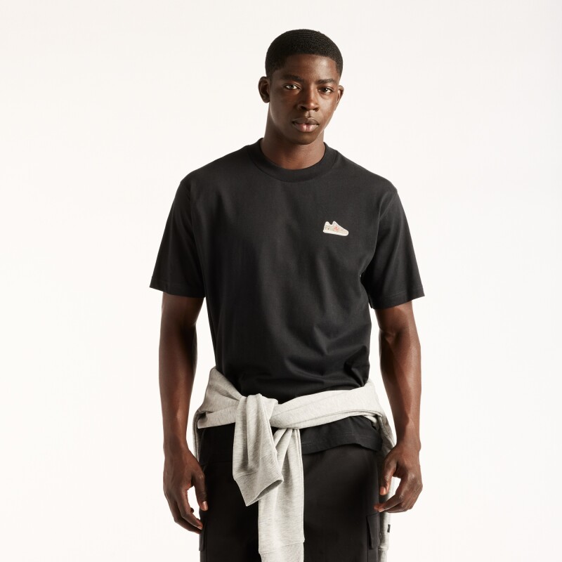 Remera New Balance de Hombre - Sticker Pack - MT62E2FFBK BLACK