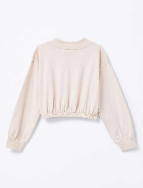 BLUSA INFANTIL CON CUELLO ALTO Y ESTAMPA BEIGE