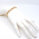 Pulsera en oro 18k con aros lisos y otros labrados Pulsera en oro 18k con aros lisos y otros labrados