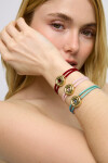 PULSERA DE CUERO DOBLE ROJA CON DETALLE DE OJO EN ALEACIÓN DE METALES BAÑADO EN ORO 18K Y CRISTAL Pulsera