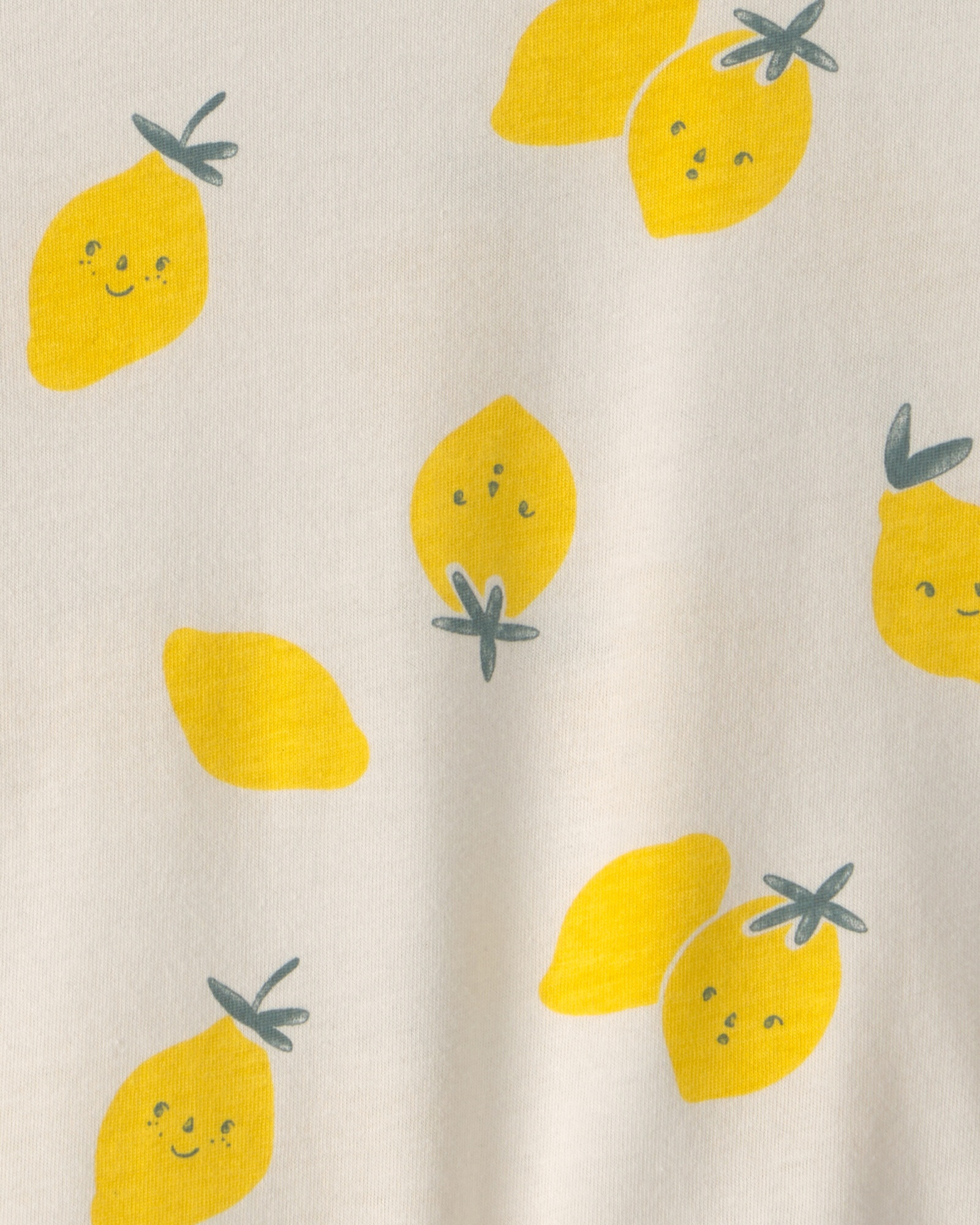 Remera de algodón, manga corta, color crema, diseño limones Sin color