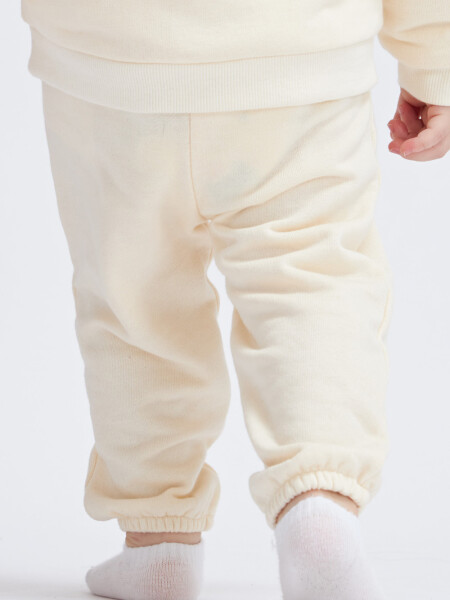 Pantalón deportivo liviano Crema