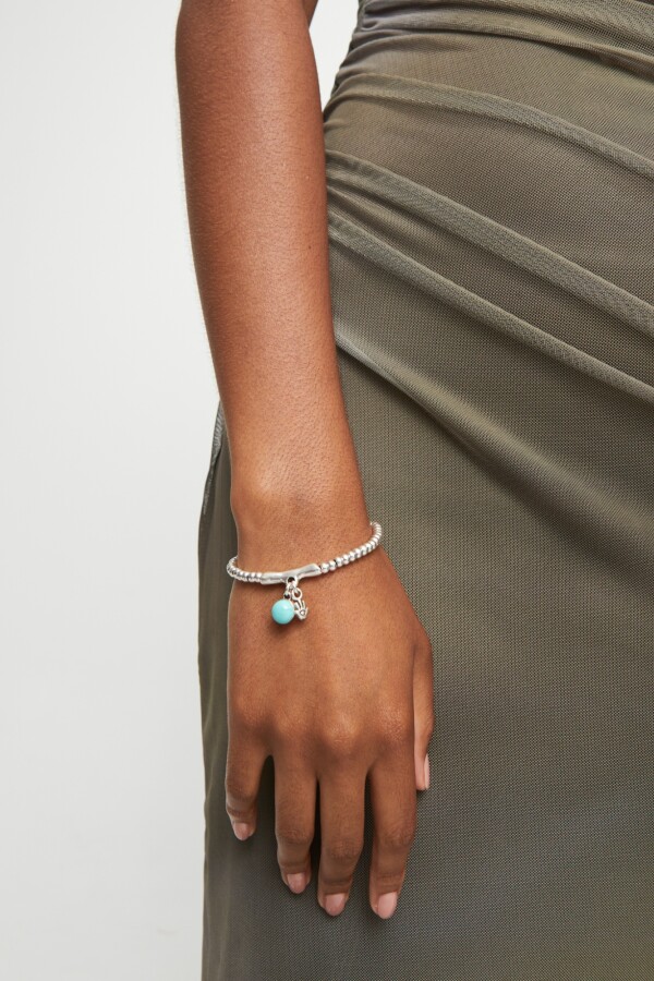 PULSERA EN ALEACIÓN DE METALES BAÑADAS EN PLATA DE LEY Y CRISTAL DE MURANO TURQUESA Pulsera