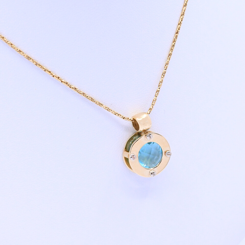 Colgante oro 18k 2 tonos con topacio azul. Colgante oro 18k 2 tonos con topacio azul.