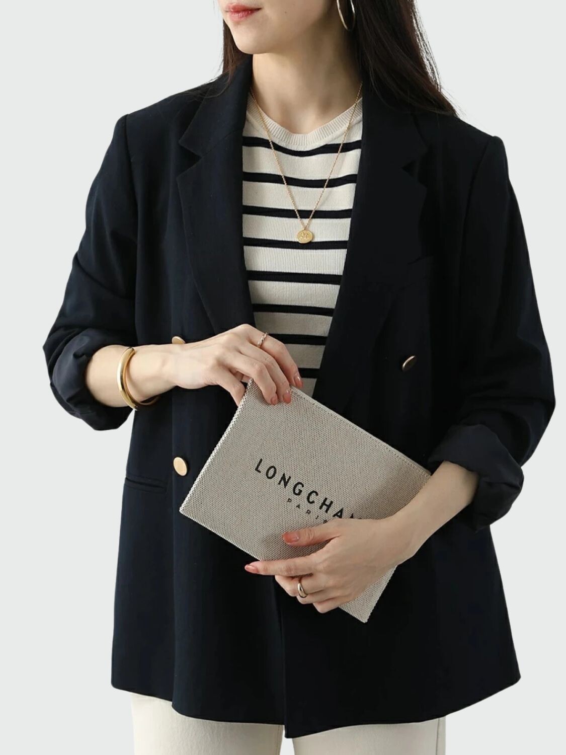 Longchamp -Sobre plano de material textil con logo Marfil