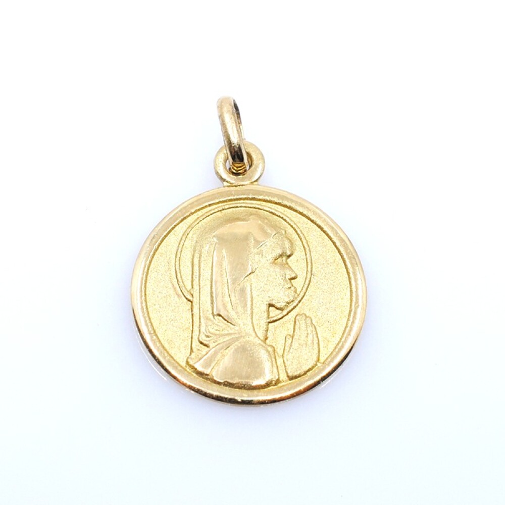 Medalla en oro 18k amarillo con imagen religiosa. Diámetro 14mm Medalla en oro 18k amarillo con imagen religiosa. Diámetro 14mm