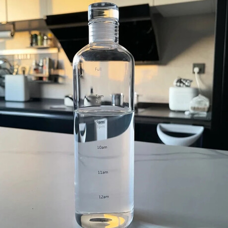 Botella de vidrio con medidas y tapón Sc