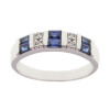 Anillo Calypso en oro blanco 18k con brillantes y zafiros azules Anillo Calypso en oro blanco 18k con brillantes y zafiros azules