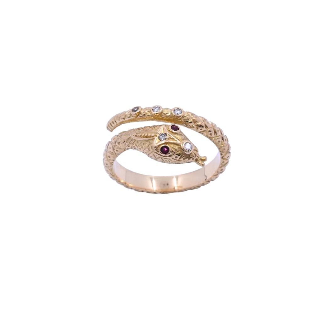 Anillo oro 18k brillantes y rubíes serpiente con punzones. Anillo oro 18k brillantes y rubíes serpiente con punzones.