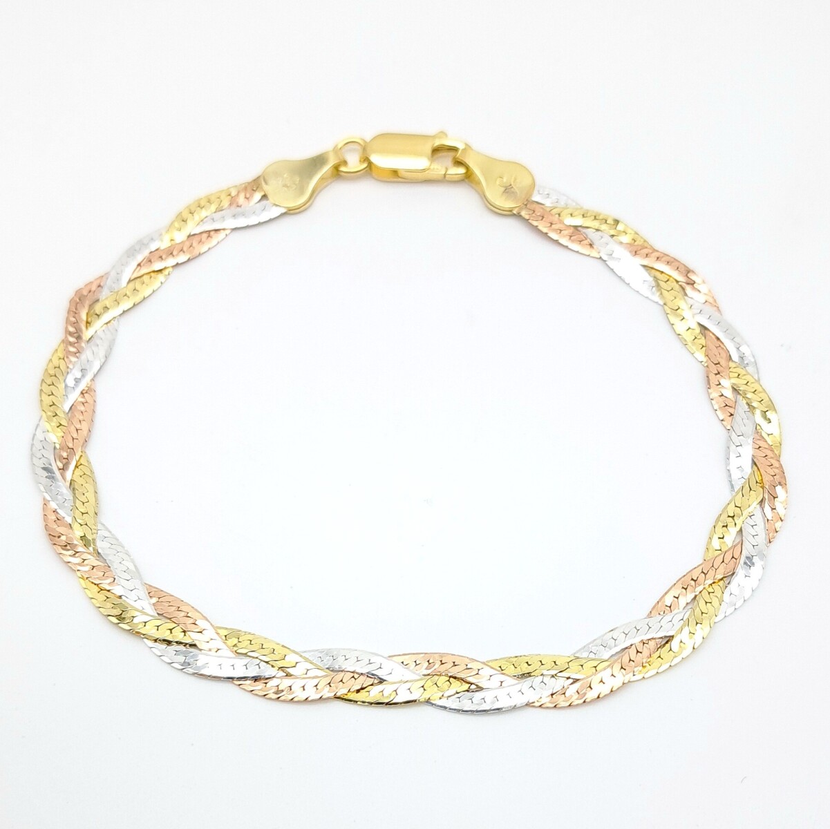 Pulsera trenzada en plata 925 con baño de oro. 