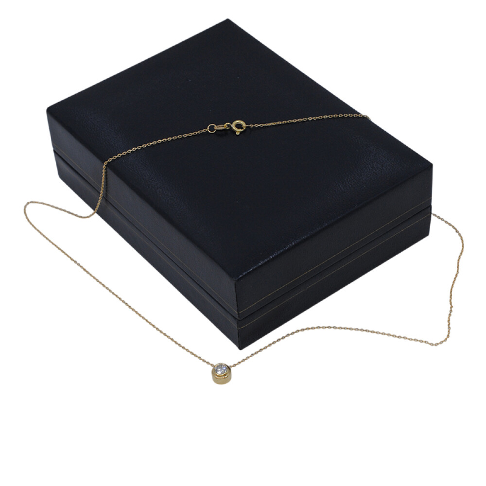 Dije en oro 18k y brillante engarce inglés Dije en oro 18k y brillante engarce inglés