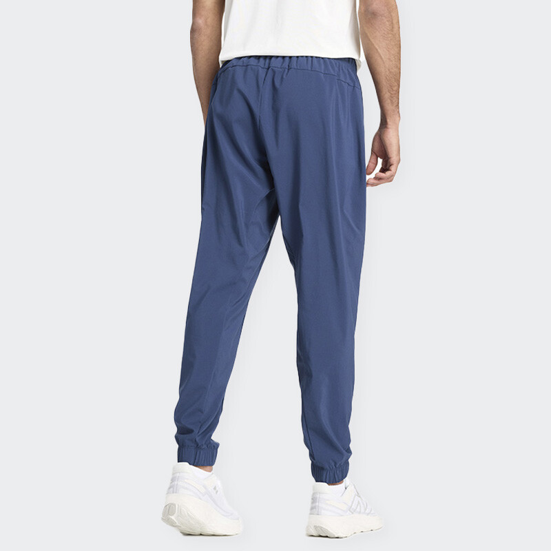 Pantalón New Balance Sport Essentials Woven Jogger Azul