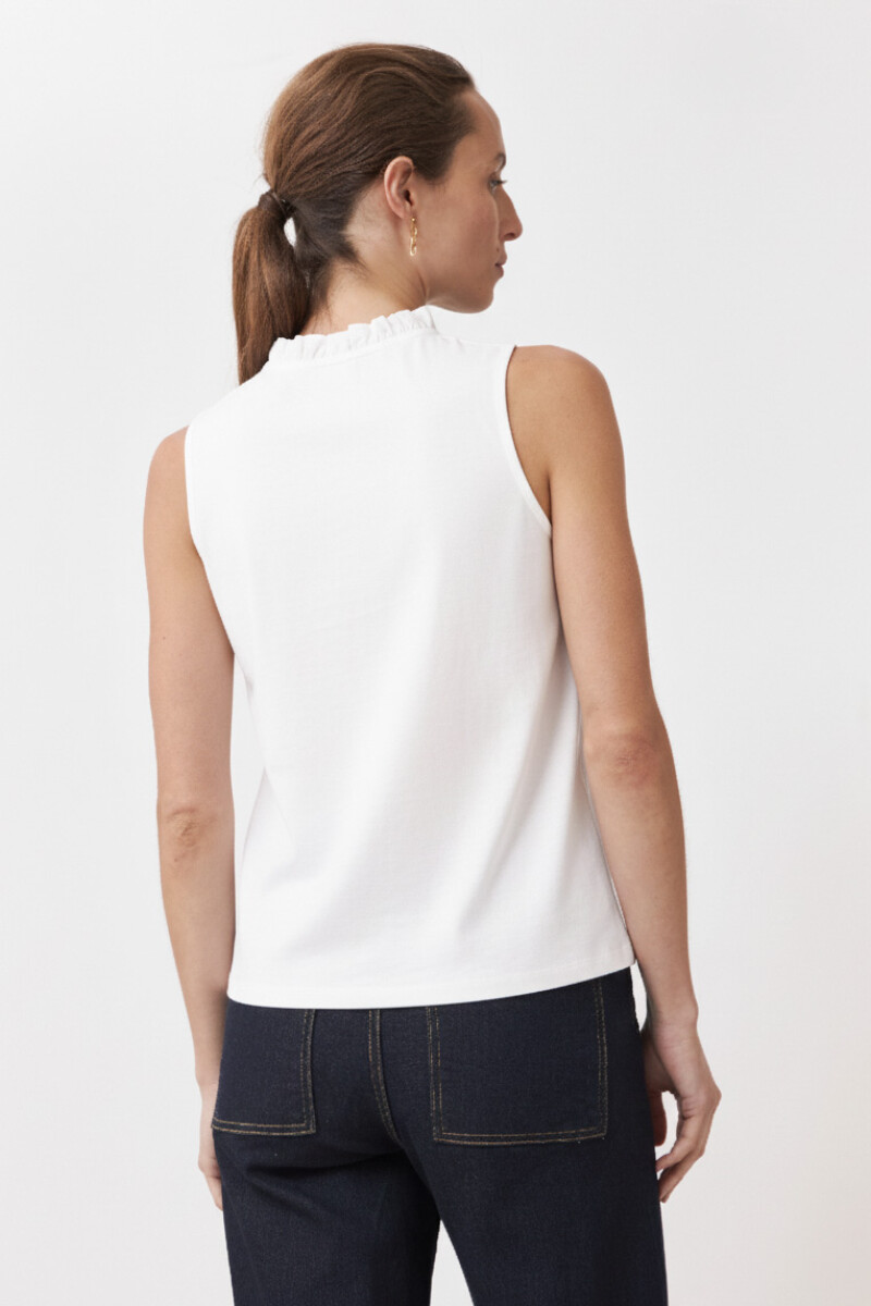 Top con broderie y volados blanco