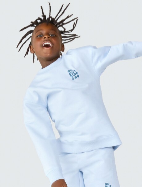 BUZO INFANTIL CON ESTAMPA MODELO OVERSIZE CELESTE