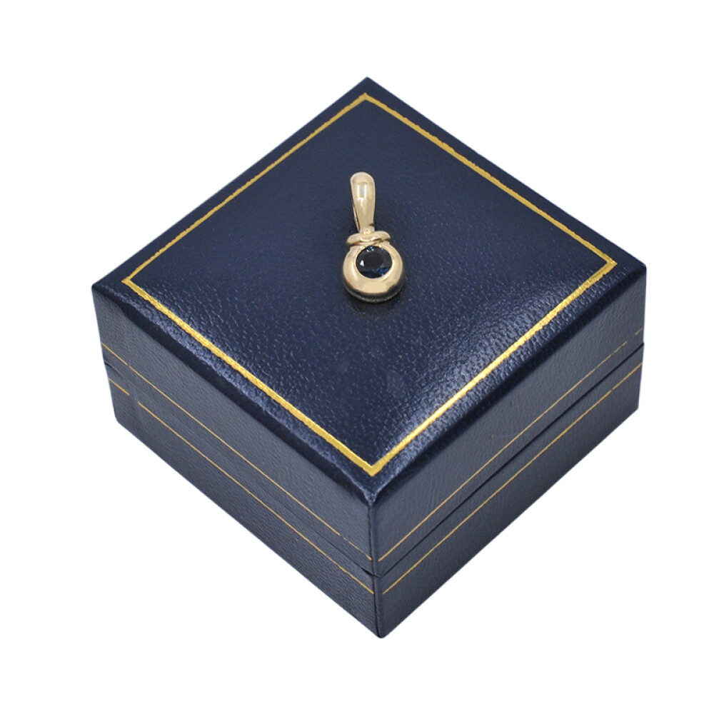 Colgante en oro 18k con zafiro azul Colgante en oro 18k con zafiro azul
