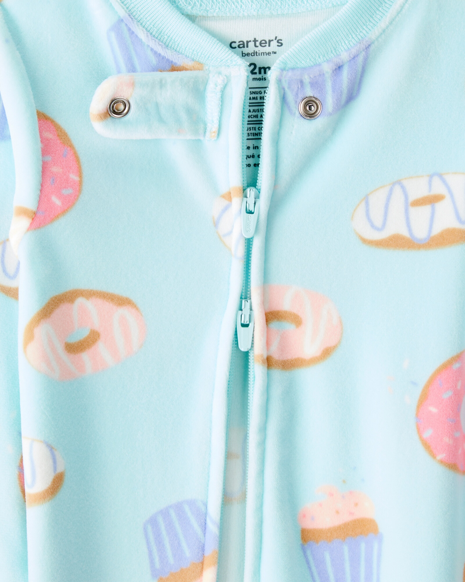 Pijama una pieza de micropolar, con pie, diseño donas Pijama una pieza de micropolar, con pie, diseño donas