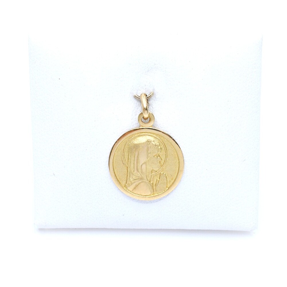Medalla en oro 18k amarillo con imagen religiosa. Diámetro 14mm Medalla en oro 18k amarillo con imagen religiosa. Diámetro 14mm