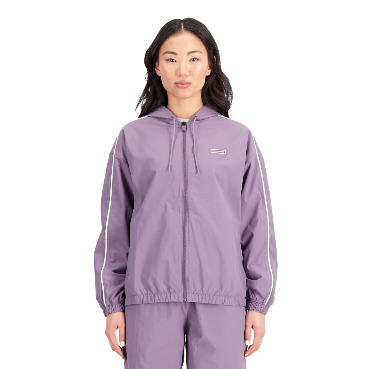 Campera New Balance de Dama - ESSENTIALS WOVEN - WJ33502SHW - PURPLE 