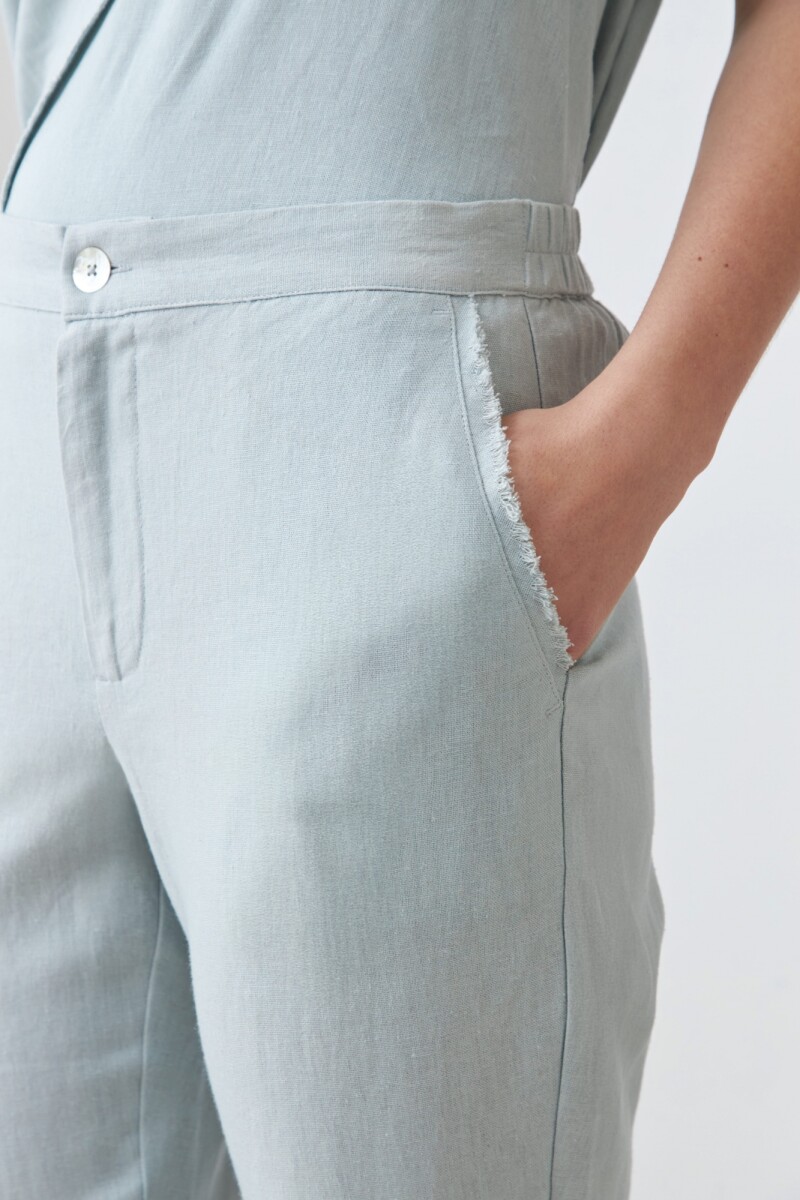 Pantalón de lino con efecto desflecado verde agua
